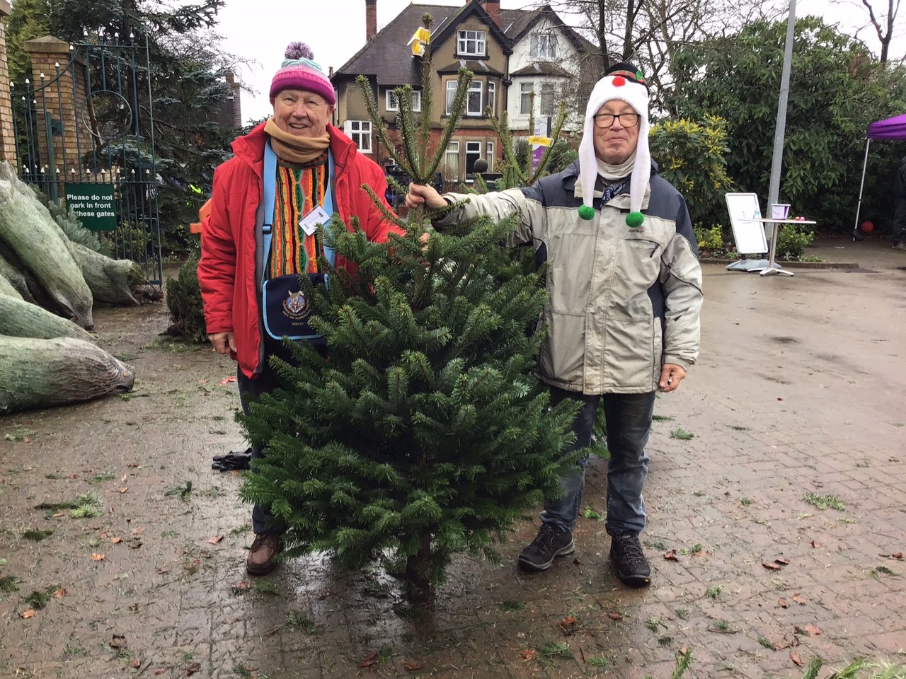 Two supporters collecting their Christmas Tree